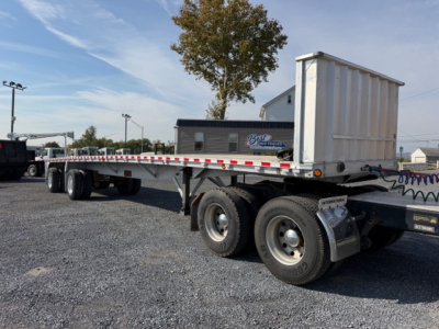 Flatbed trailer with dual rear axles and drop-down bed, 2004 Reitnouer MaxMiser 45x96. VIN 1RNF45A224R009969, stock 12953, category flatbed trailer in-use.