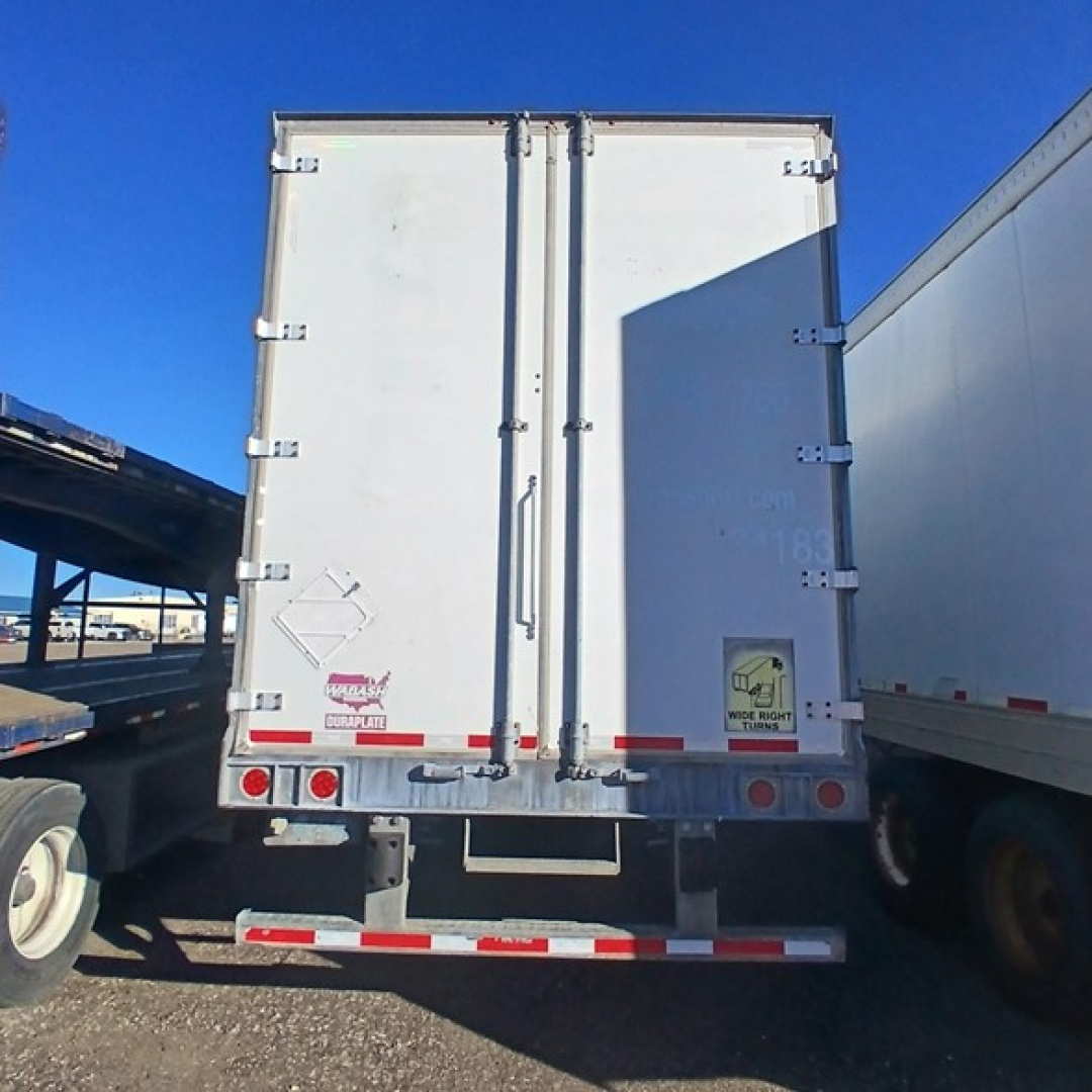Rear of a 2014 Wabash air ride dry van trailer showing closed double doors and rear lights.