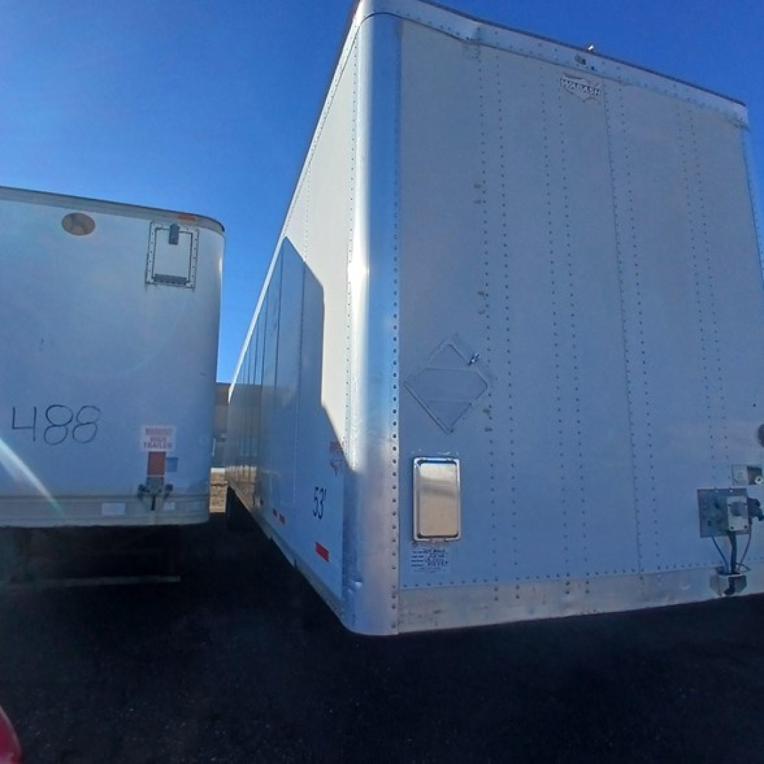 Trailer rear view of a 2014 Wabash air ride dry van with riveted aluminum doors and side marker lights.
