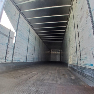 Trailer interior showing empty Wabash air ride dry van cargo area with metal sidewalls and wooden floor.