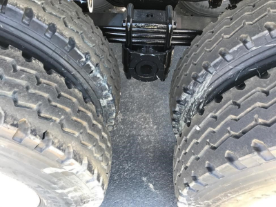 Ranco Ed60-38 trailer hitch area with dual rear tires and suspension components visible between wheels.