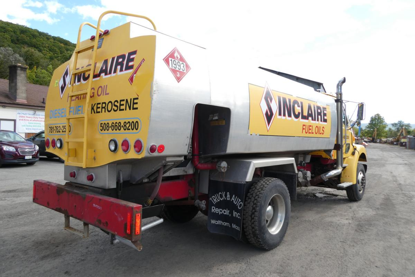 Sterling L7500 fuel truck with Dennisville Inclair Fuel Oils markings and a diesel fuel tank rear view.