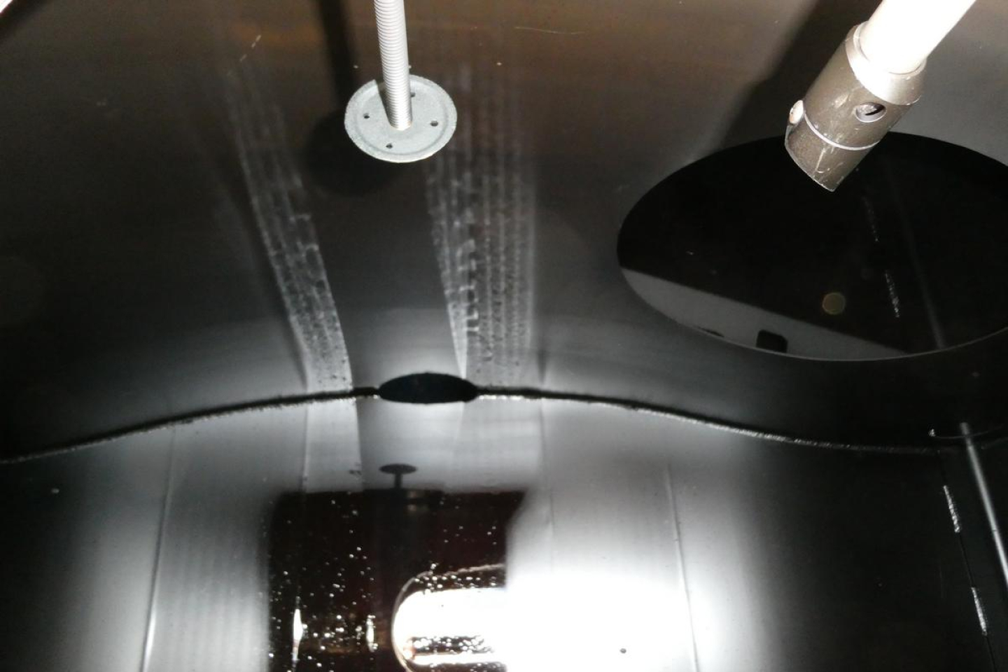 Sterling L7500 truck fuel system interior showing welded seams and piping connections with circular access ports.