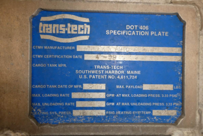 Trans-tech dot 406 specification plate on truck showing CTMV manufacturer, date 4-99, cargo tank, max payload, max loading rate, max unloading rate, various PSI ratings.