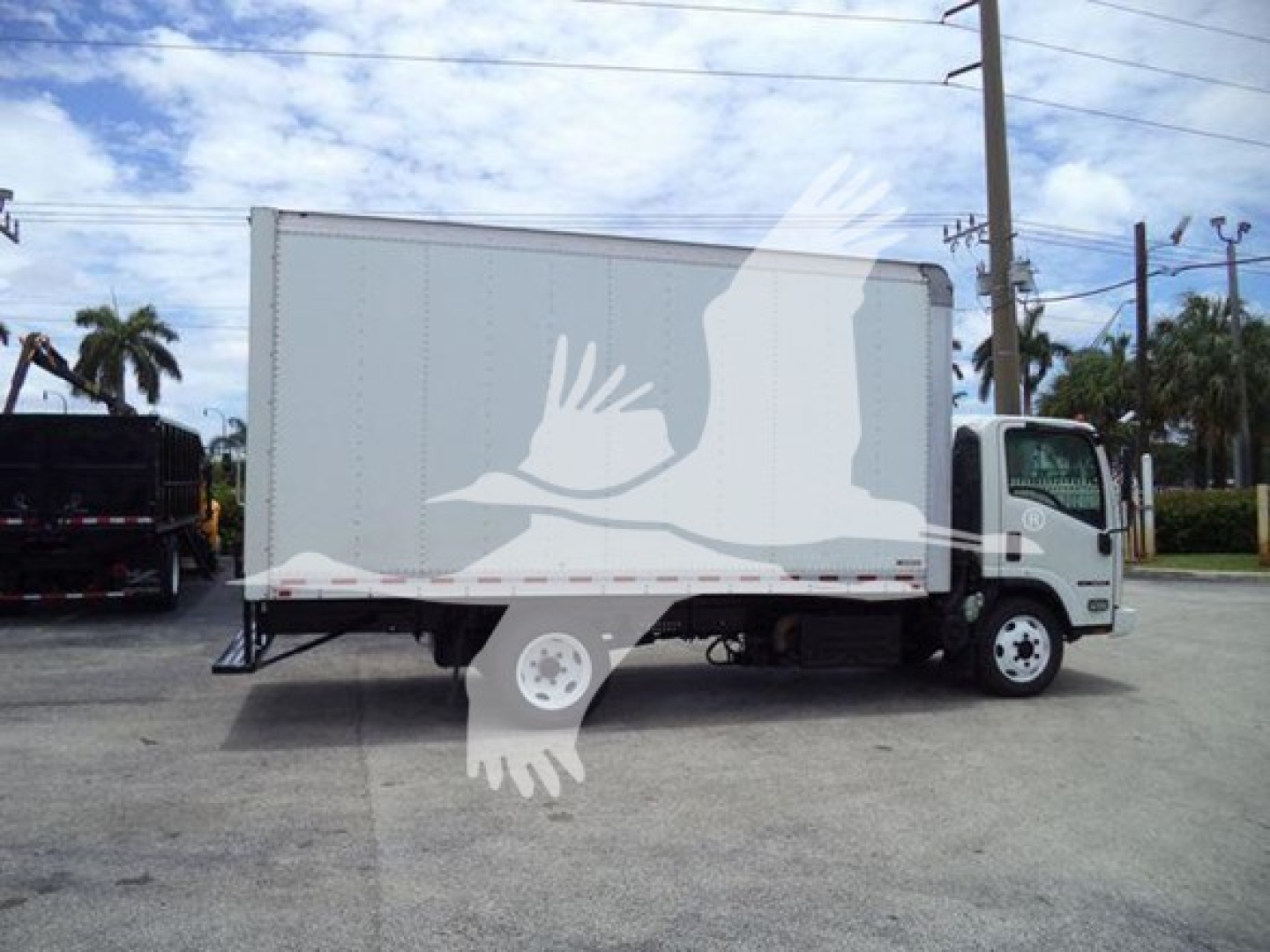 Isuzu NRR box truck from side view showing cargo box and cab with stock number T00719 and VIN JALE5W165K7300719.