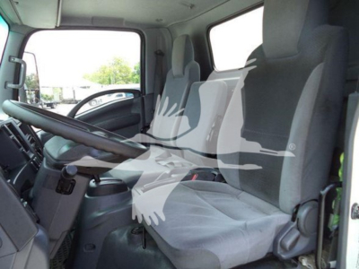 Isuzu NRR truck interior showing front seats and steering wheel.