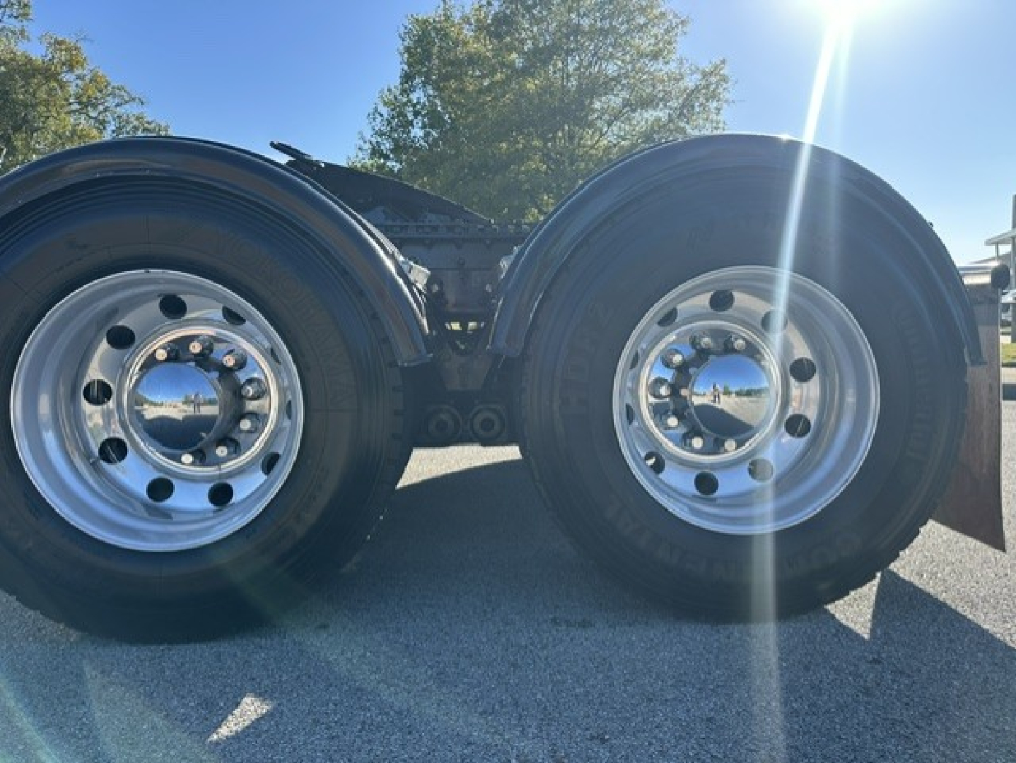 Kenworth T880 chassis view showing dual rear axles and wheels.