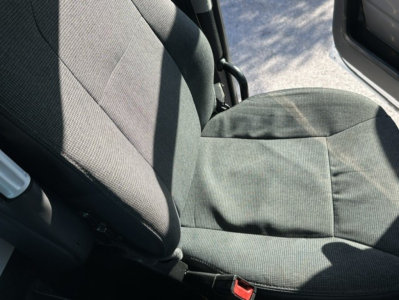 Kenworth T880 cab interior showing front seat and seat fabric. 