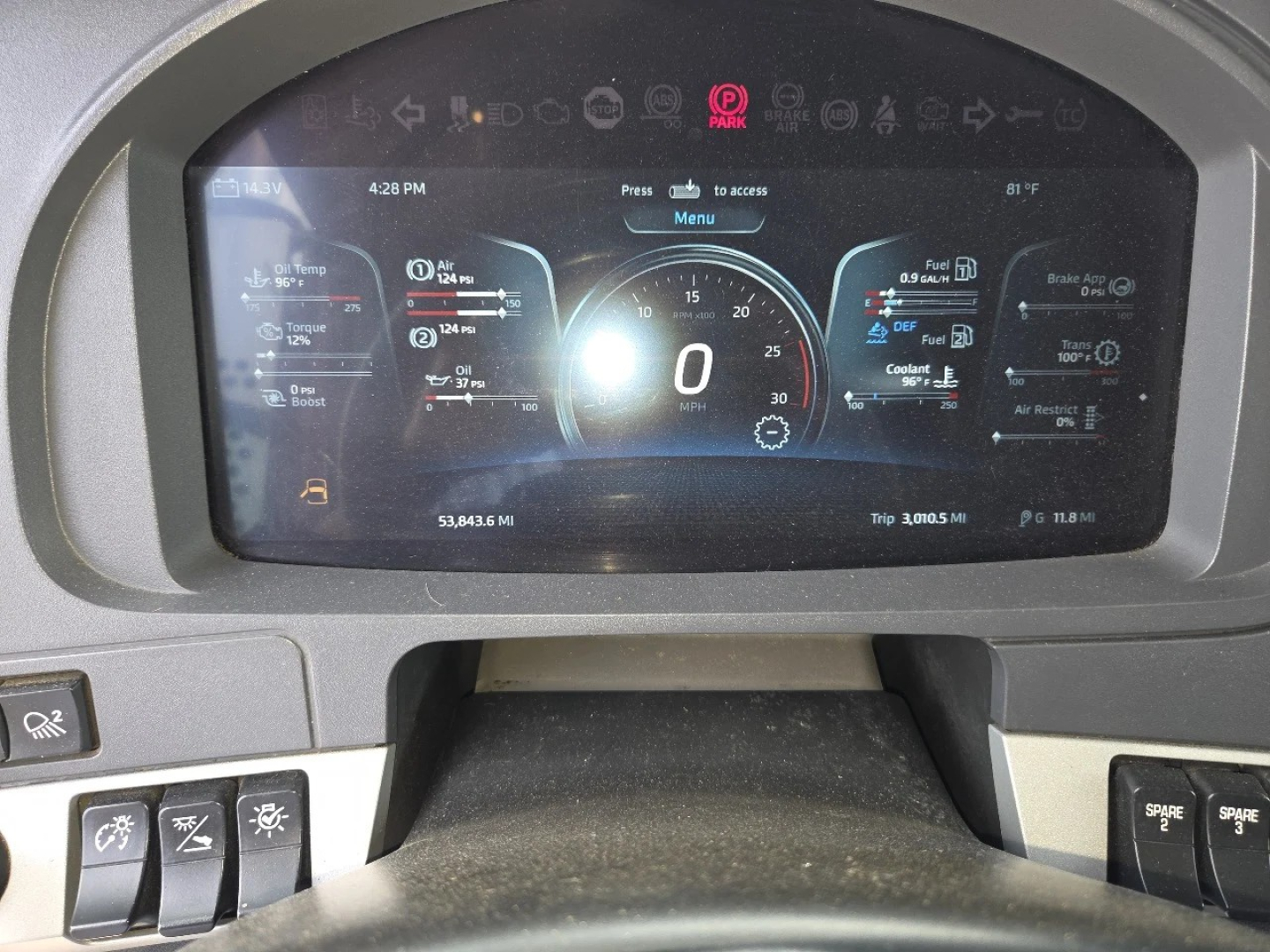 Kenworth W990 dashboard display showing digital gauges and vehicle information.