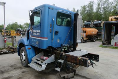 Blue Freightliner CL112 day cab truck rear view showing steps and exhaust, with VIN and stock information not visible.