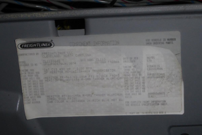 Freightliner component information label showing VIN and model details. Text includes 'FREIGHTLINER' logo, 'COMPONENT INFORMATION', and various codes and numbers such as VIN, model, and other specs.