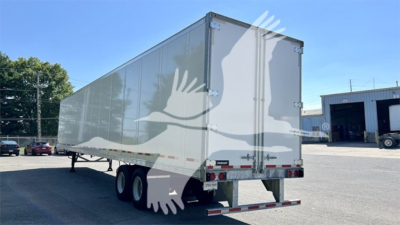 Fruehauf plate van trailer rear view showing tandem axle, rear doors, and light bar.