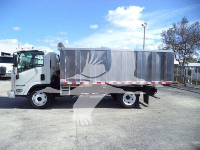 Isuzu NPR-HD dealer truck with a silver dump body, side profile view, cab in front, stock number T04505, VIN 54DC4W1B5HS804505.