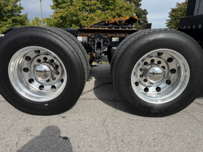 Kenworth T680 dual rear wheels on trailer chassis showing wheels and hubs.