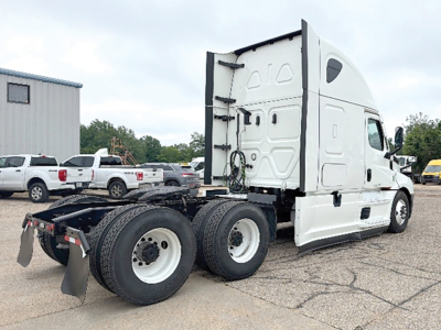 Freightliner Cascadia126 tractor rear view showing dual rear axles and fifth wheel mounting