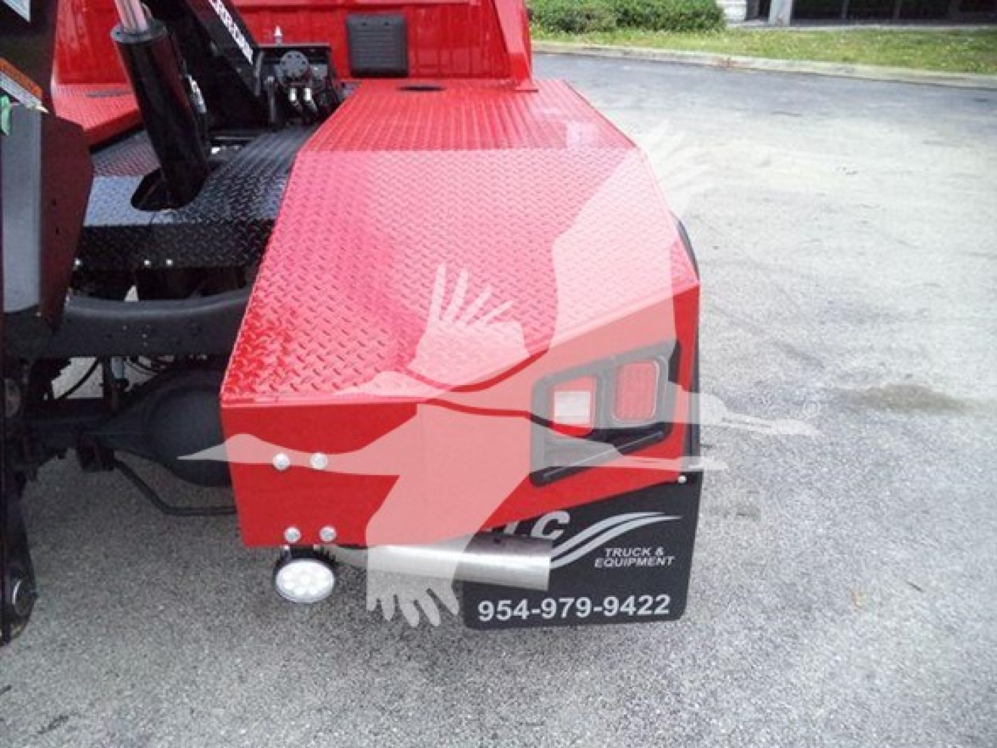 Ram 4500 front quarter showing winch category equipment with red textured fender and small white marker light.