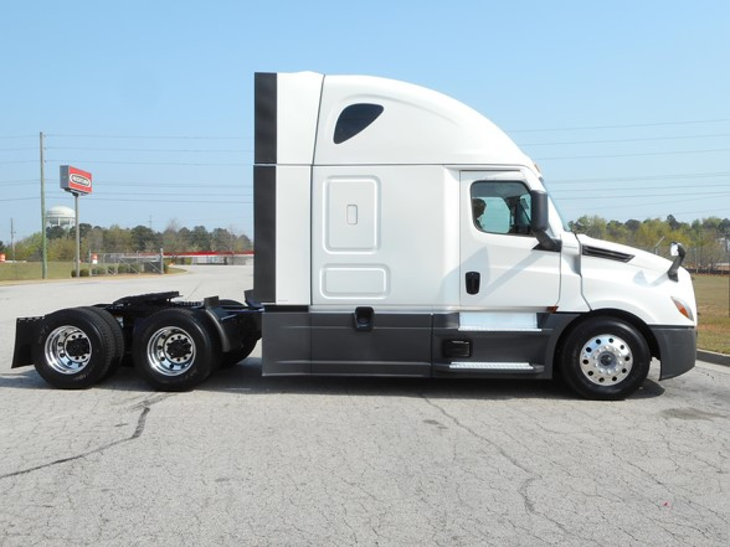 Freightliner Cascadia 126 tractor from side view showing cab and sleeper, with no discernible text visible on the side panels or decals.