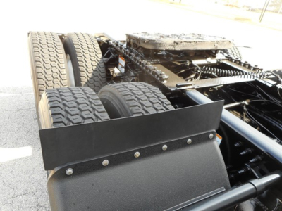 Freightliner Cascadia 126 chassis with dual rear axles and a front frame rail showing a flat tool box/deflector, engine bay not visible.