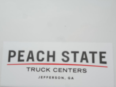 Peach State Truck Centers sign with large PEACH STATE text and smaller TRUCK CENTERS JEFFERSON, GA