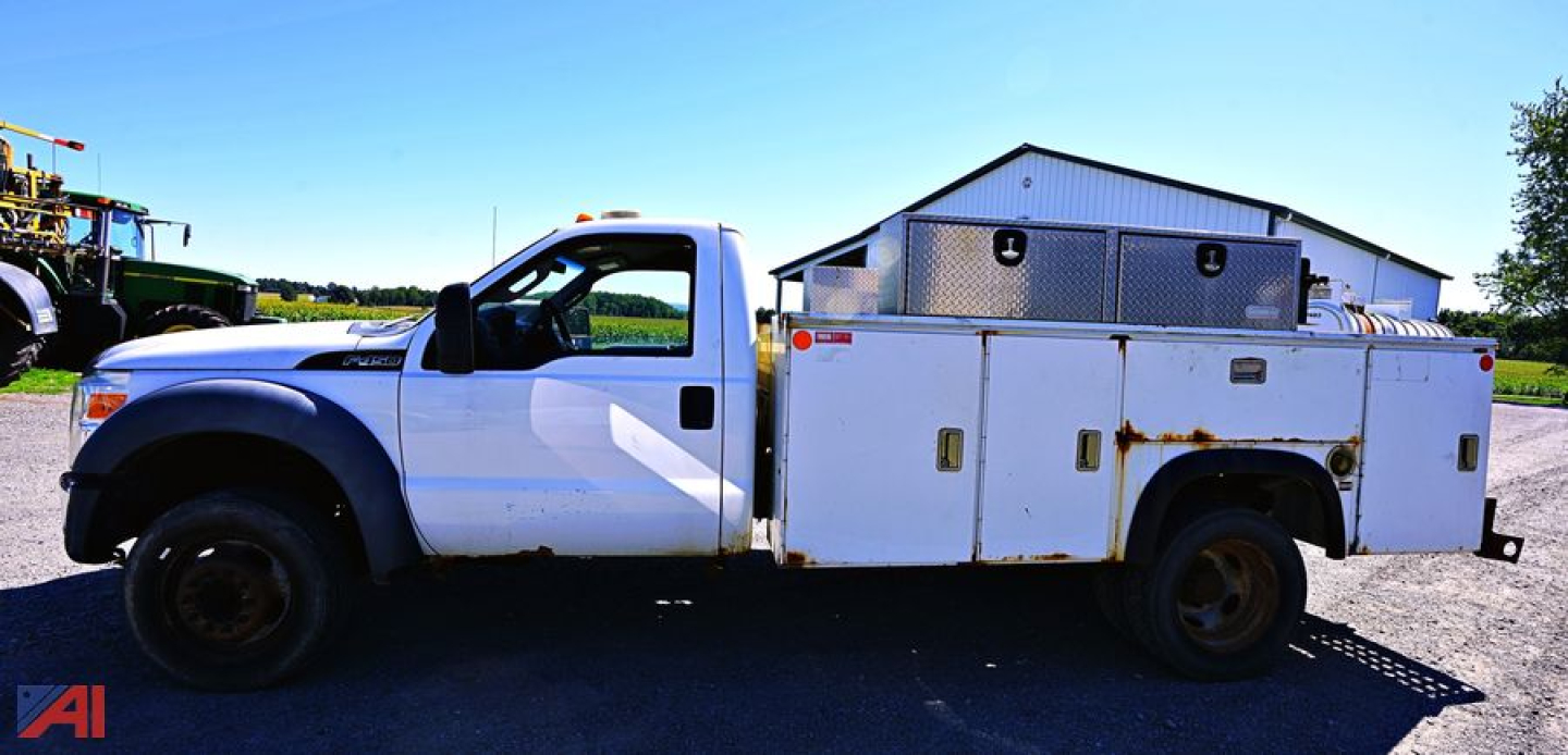 Service/utility truck side view showing utility bed with storage compartments and toolboxes on Ford F-450 chassis.