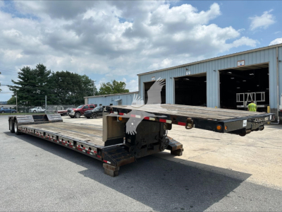 Double Drop Expandable trailer in a yard showing two flatbeds extended and hydraulic neck area, XL Specialized XL80Mfga.