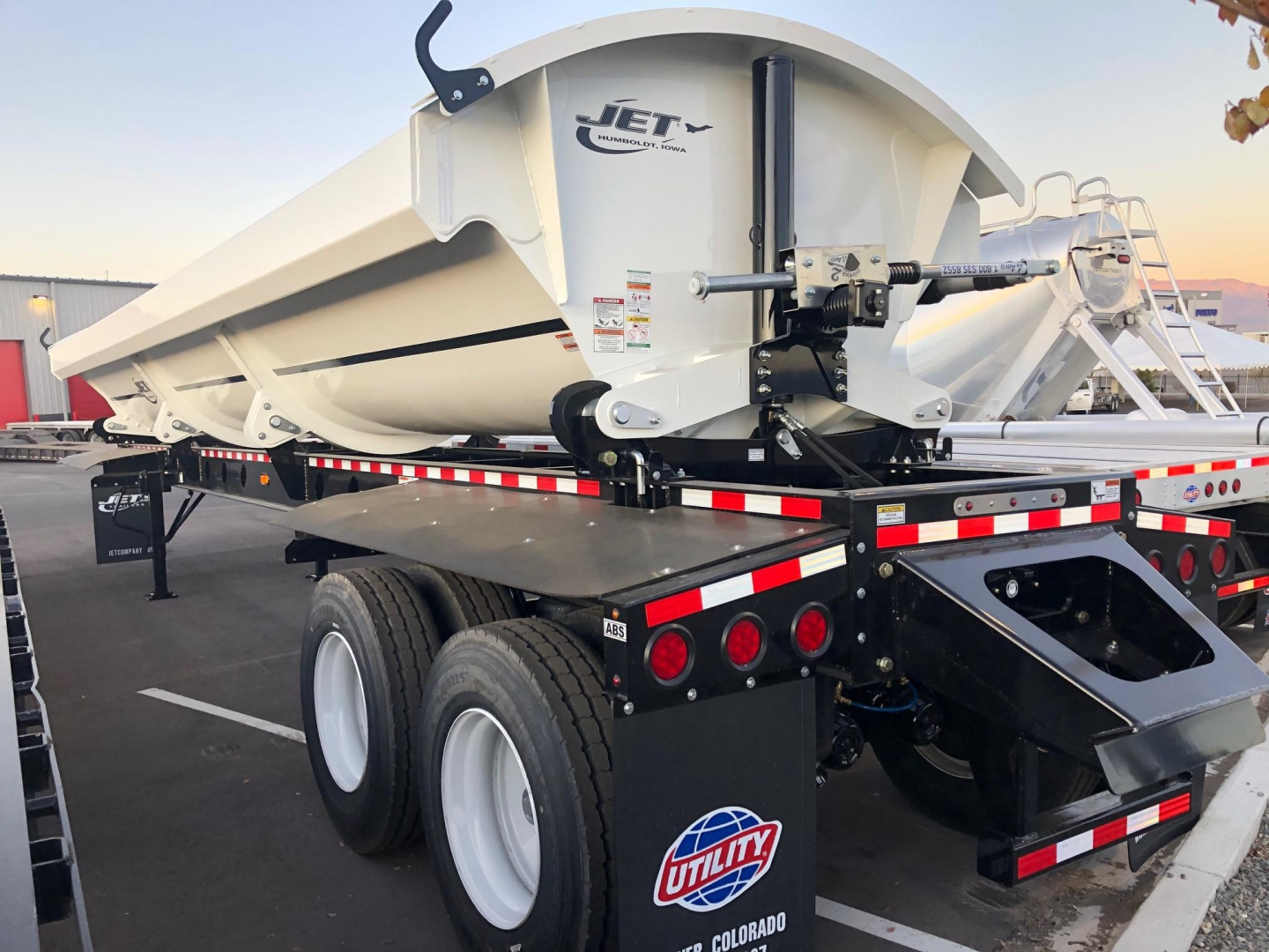 Jet 40' air ride side dump trailer showing 2-way valve and electric roll with rear underride and dual rear axles.