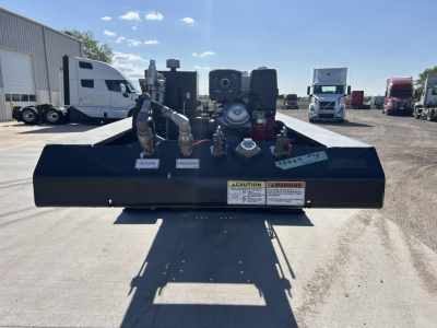 Loader-view of Load King trailer base with hoses, pumps, and warning labels visible on the front edge; 8'-6" width, 18"…