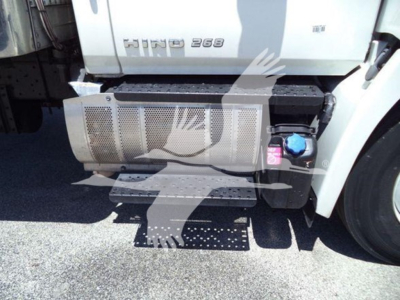 Hino 268 truck side showing fuel and def/aux reservoirs and lower steps.