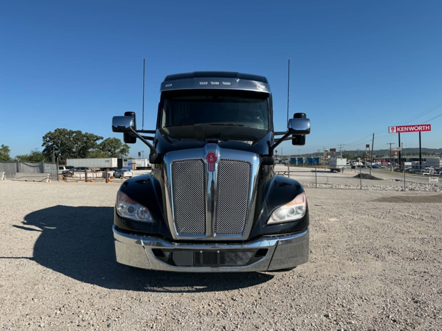 Kenworth T680 front view showing chrome grille, bumper, and emblem.