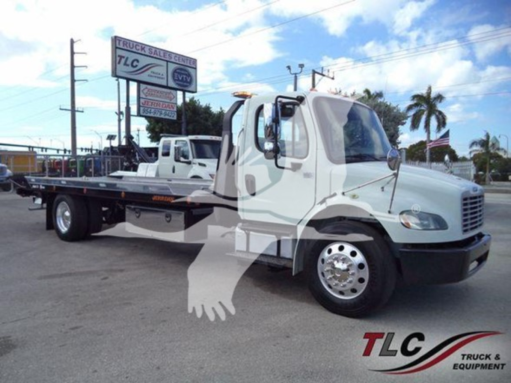 Freightliner Business Class M2 106 roll-back truck in white with flatbed, side view showing cab and wheels.