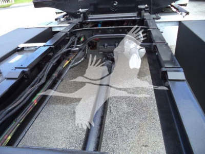 Truck chassis showing hydraulic lines and run/roll back frame of a 2019 Freightliner Business Class M2 106.