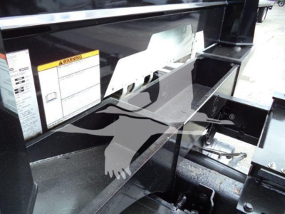 Freightliner Business Class M2 106 rollback truck bed area showing control labels and step/compartment