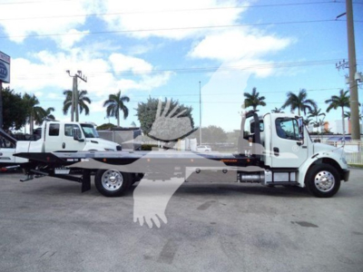 2019 Freightliner Business Class M2 106 rollback truck side view showing two white cab trucks connected by a flatbed