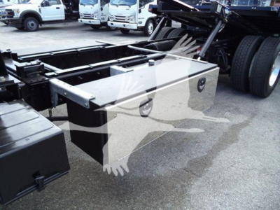 Freightliner M2 106 truck chassis with roll-back subframe showing metal toolbox and components under the cab area.