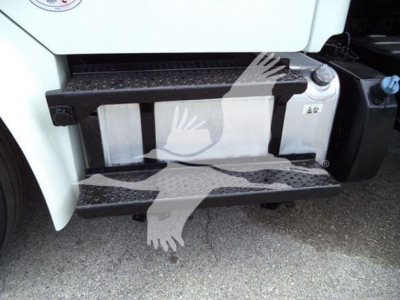 Truck side steps and fuel tank on Freightliner Business Class M2 106 with metal black steps and white cab
