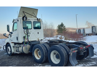 2019 Freightliner Cascadia126 tractor in three-quarter rear view showing chassis and fifth wheel with dual rear axles and tires, VIN and stock not visible in image.
