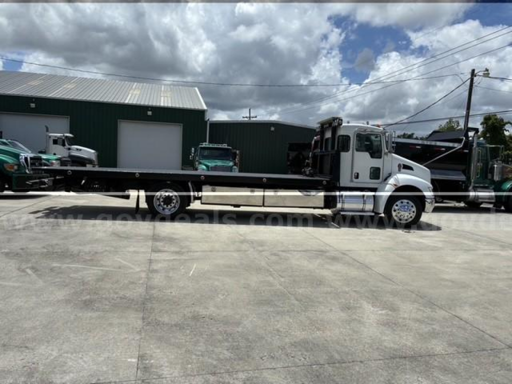 2018 Kenworth T3 Series tow truck side view showing flatbed and cab with white color.
