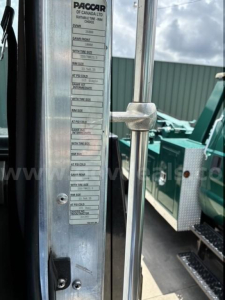 Truck door jamb label showing tire, axle, and VIN information on a Kenworth T3 Series truck.
