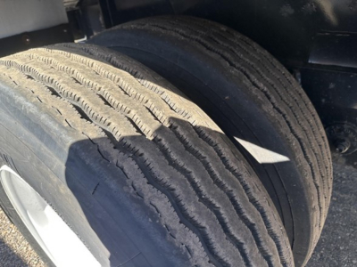 Trailer image showing dual rear tires with tread and sidewall visible, part of Fontaine 48' spread air combo flatbed listing.