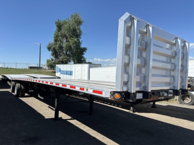 Fontaine 48' spread air combo flatbed trailer showing storage compartments at rear and dual rear axles.