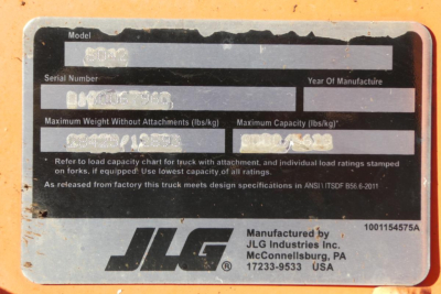 JLG 8042 machine showing the nameplate with model, serial number, and weight/capacity labels.