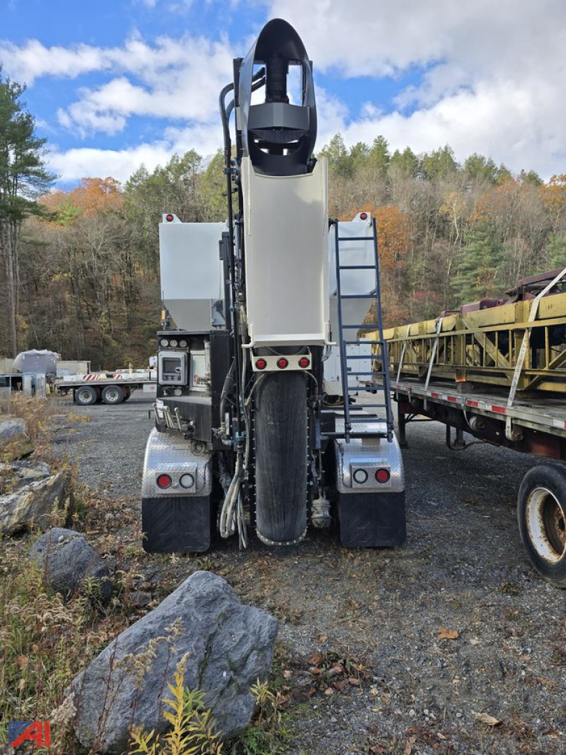 Rear view of a 2022 Mack Granite GR64F volumetric mixer truck showing clean rear section, dual rear fenders, tail lights, and mixer drum housing.