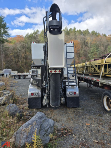 Rear view of a 2022 Mack Granite GR64F volumetric mixer truck showing clean rear section, dual rear fenders, tail lights, and mixer drum housing.