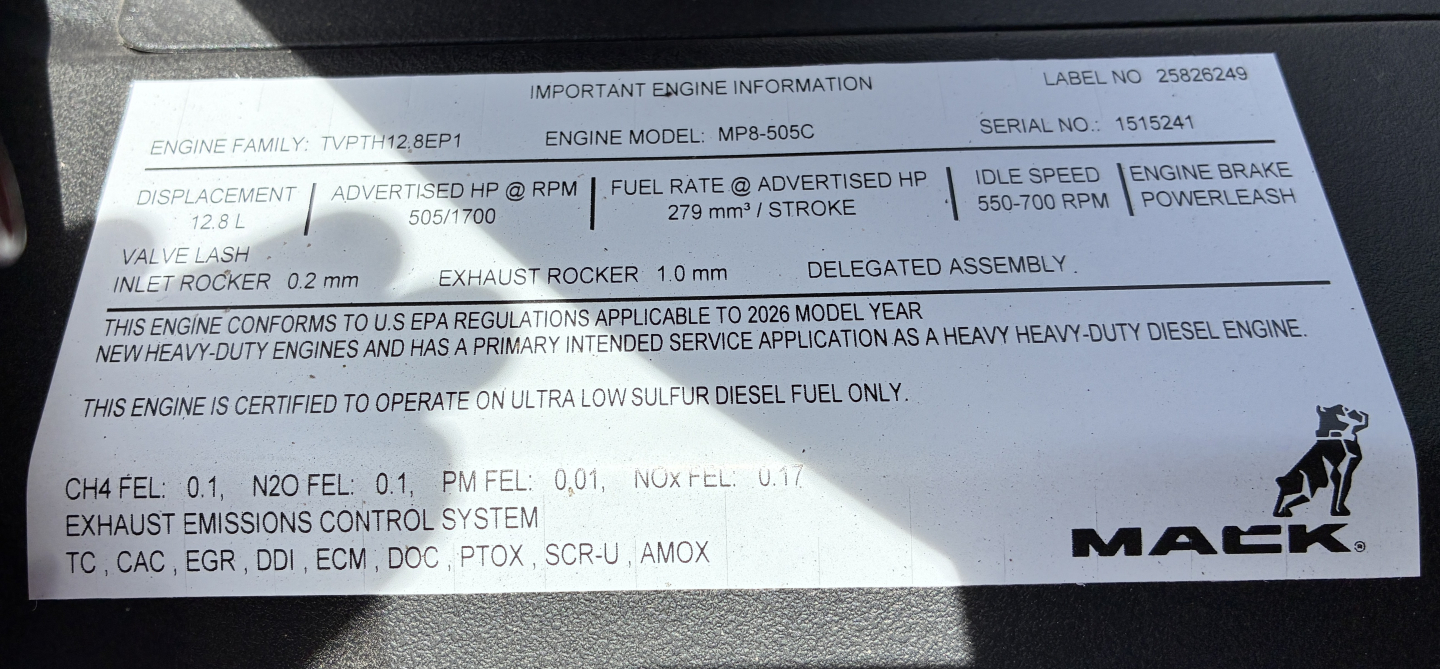Mack engine information placard showing engine family Type-FT Bep 2.0L, fuel rate, exhaust, and emission control labels with Mack logo.