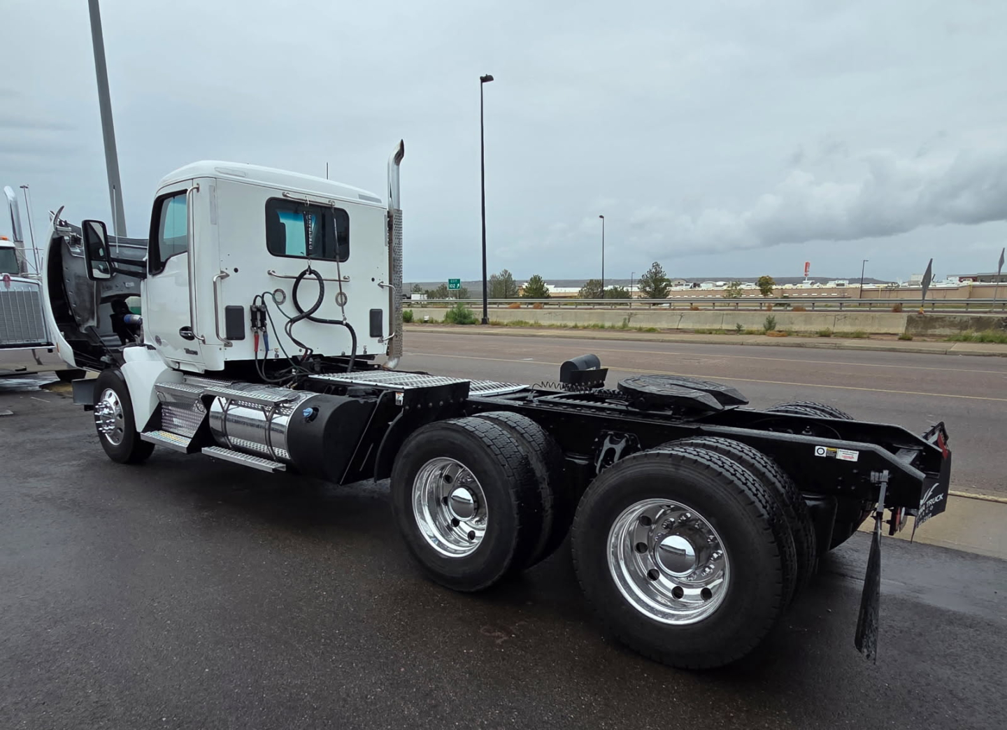 Kenworth T880 tractor in white, side view showing cab and chassis. No text visible on components in view.