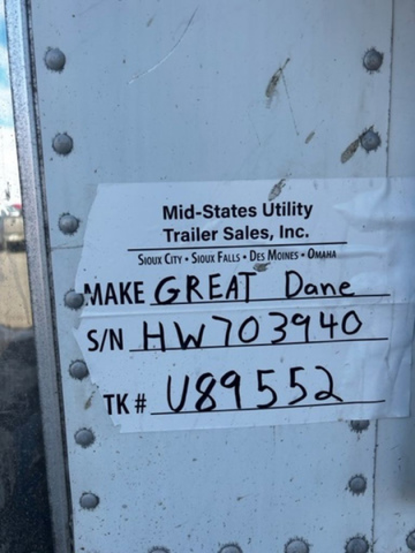 Mid-States Utility Trailer Sales label on a refrigerated trailer door with handwritten Make Great Dane and serial number HW703940.