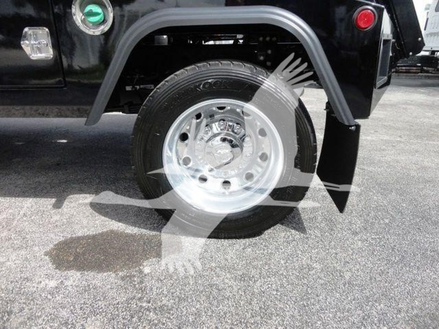 Truck wheel and fender of a 2024 Ram 4500 SLT showing chrome wheel, tire, and black fender flare.