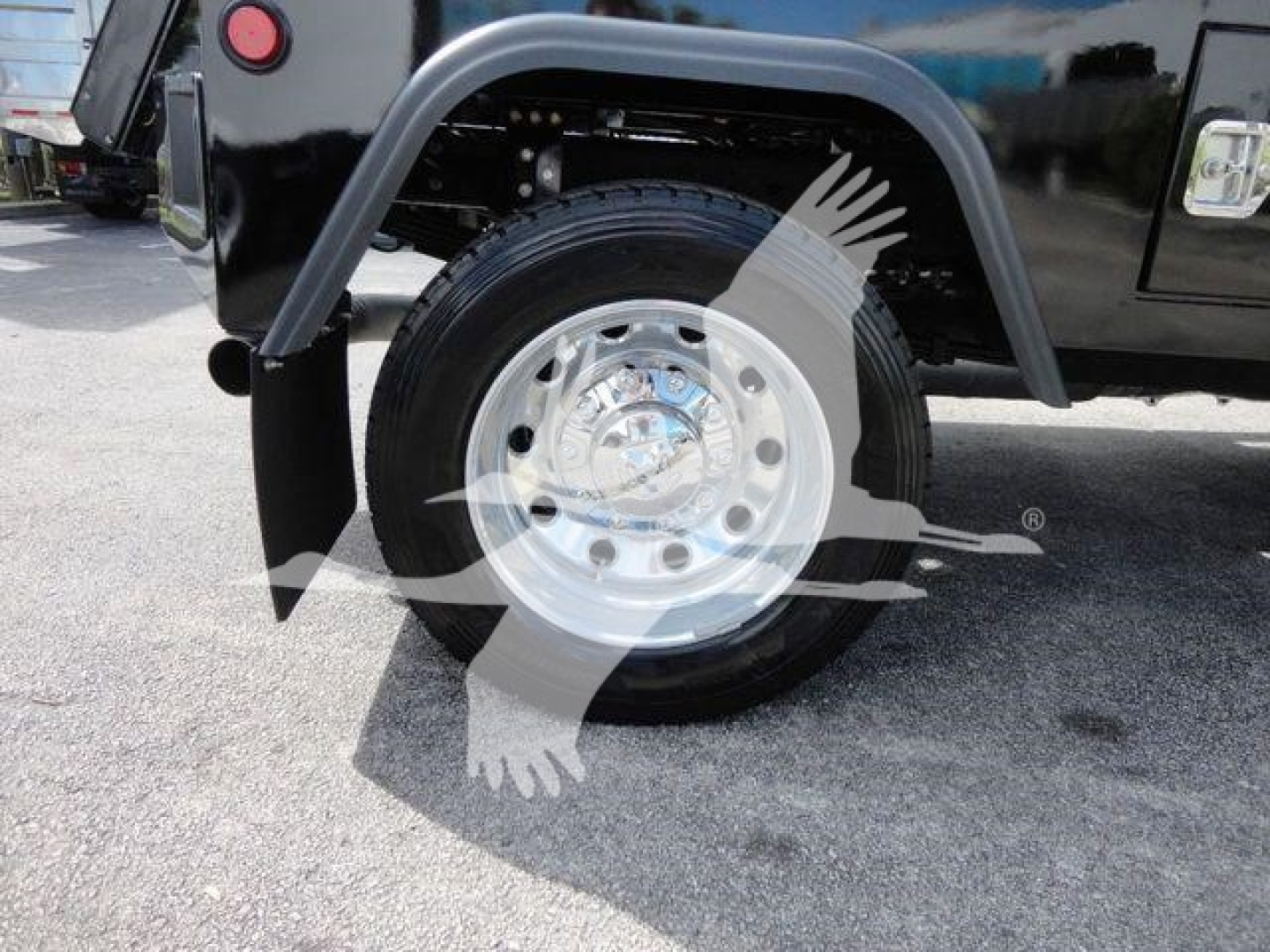 Ram 4500 truck wheel and fender showing chrome wheel and black body panel with fender flare.