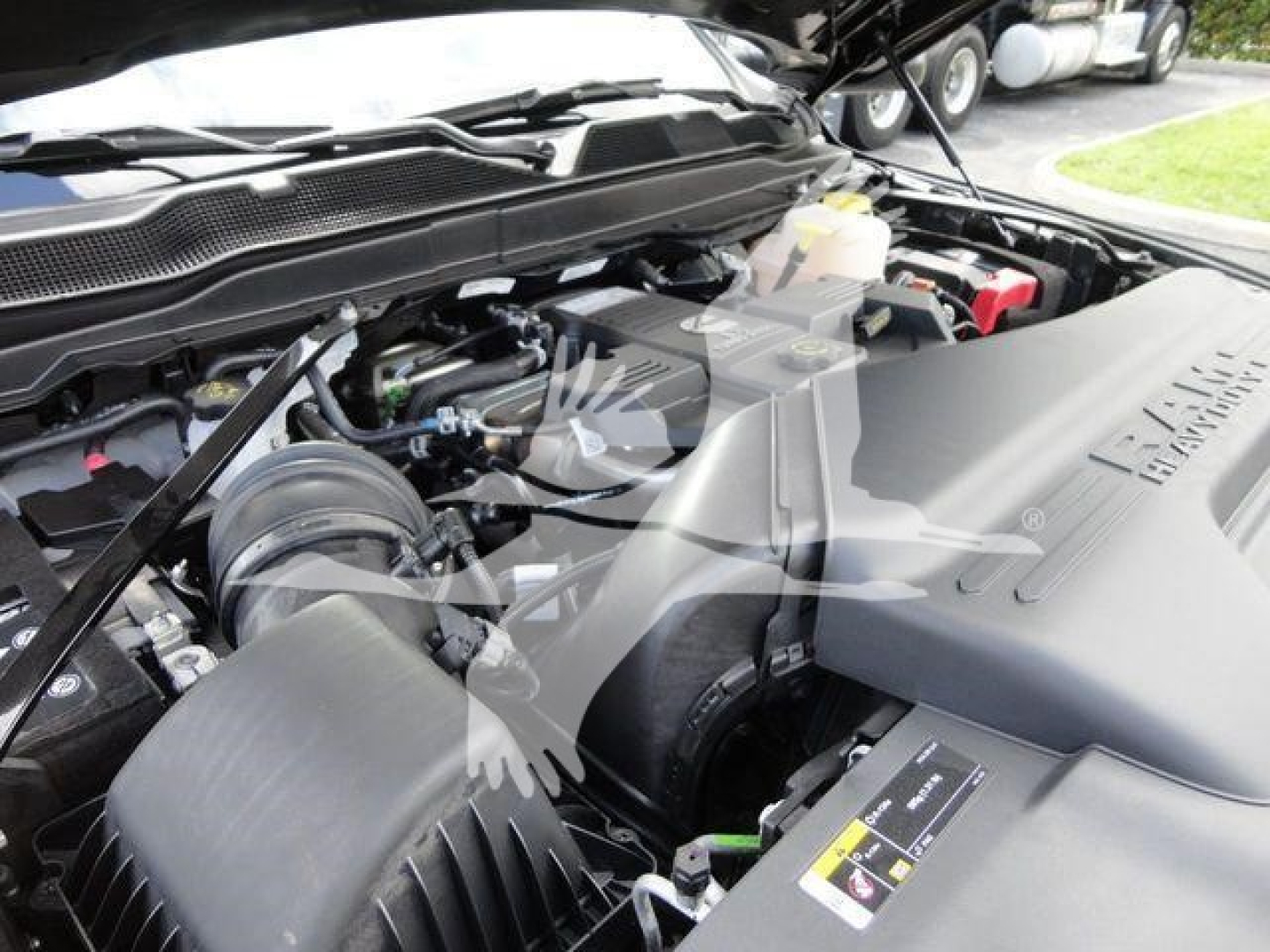 Ram 4500 engine bay showing air intake, coolant reservoir, and engine cover with Ram branding.