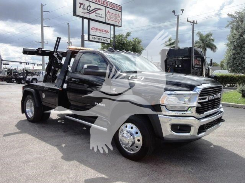 Ram 4500 pickup with winch and flatbed, front three-quarter view, with stock number J86261 in a dealership lot.
